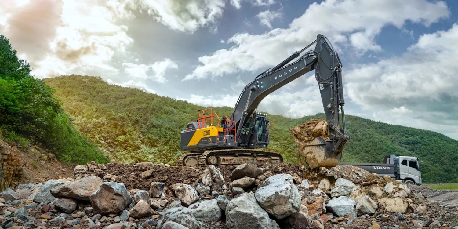 A construction vehicle digging a hole in the ground