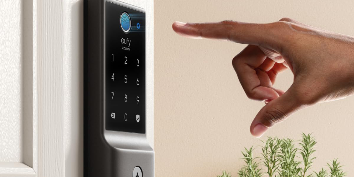 A finger pointing at a security lock