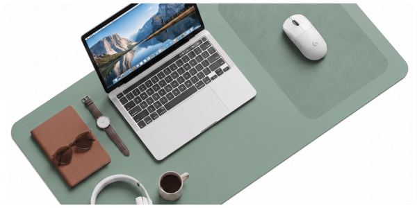 A laptop computer and mouse on a mouse pad