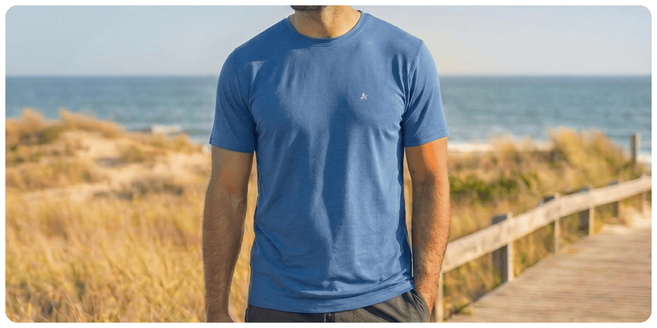 A man standing on a boardwalk