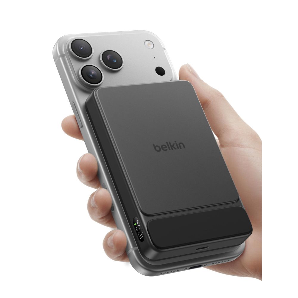 A hand holding a cell phone