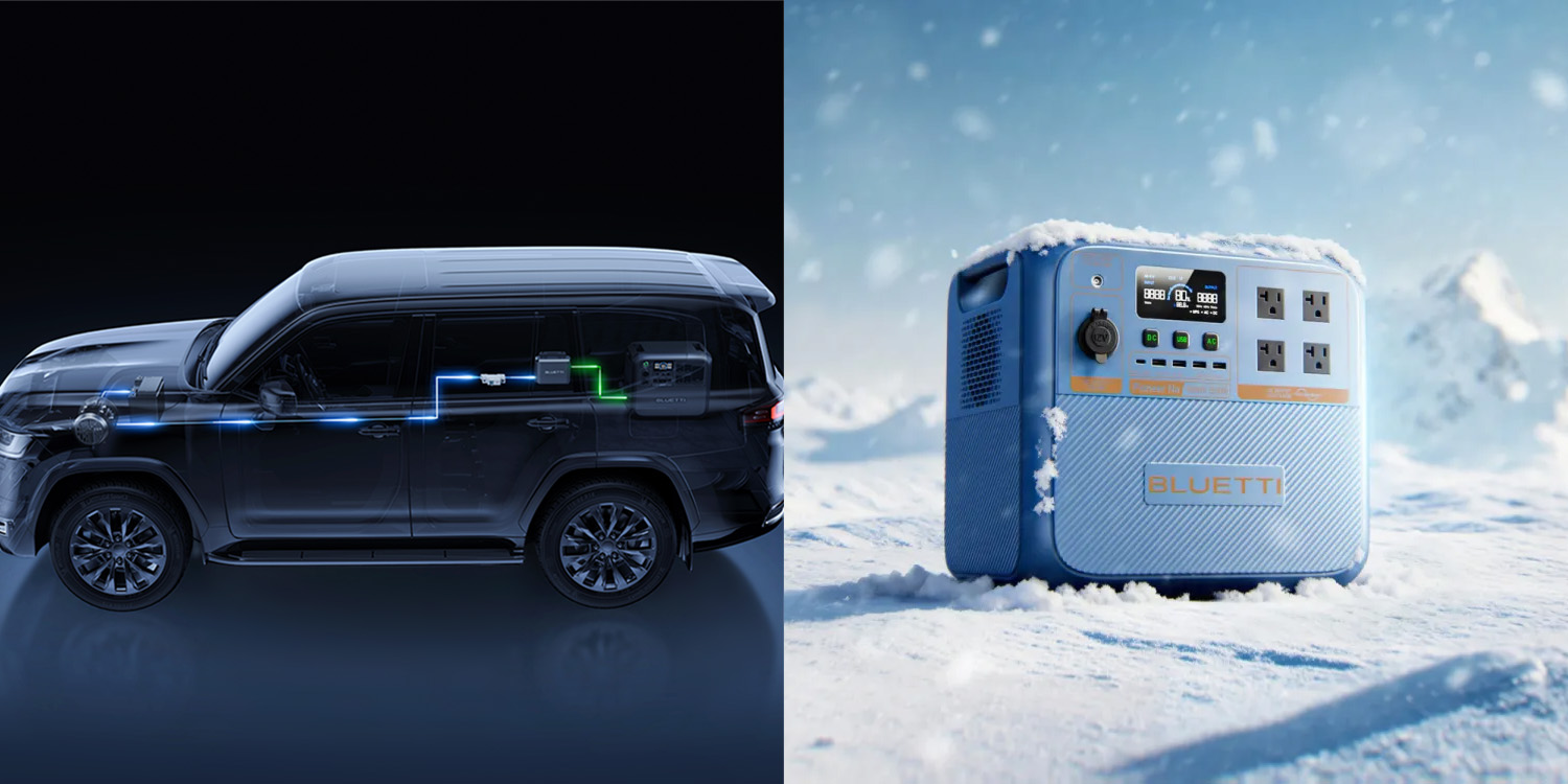 A car with electrical wires and a blue box in the snow