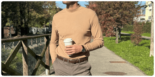 A man holding a cup of coffee