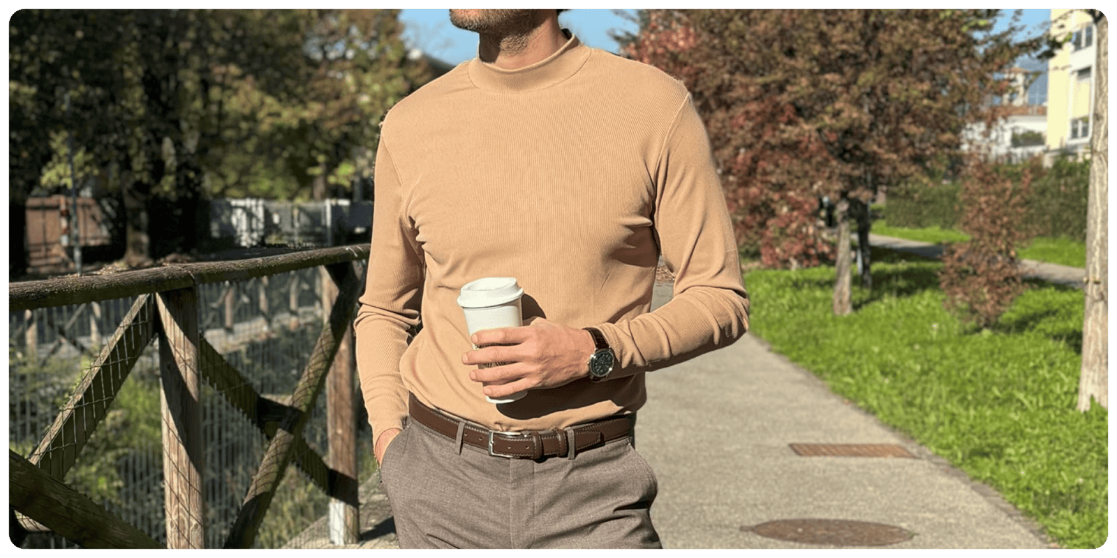 A man holding a cup of coffee