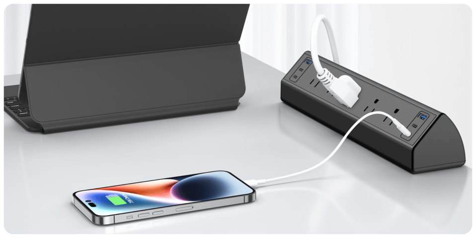 A cell phone plugged into a power strip