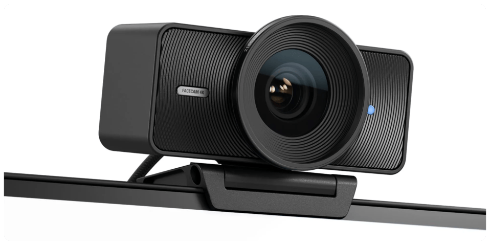 A black video camera on a stand
