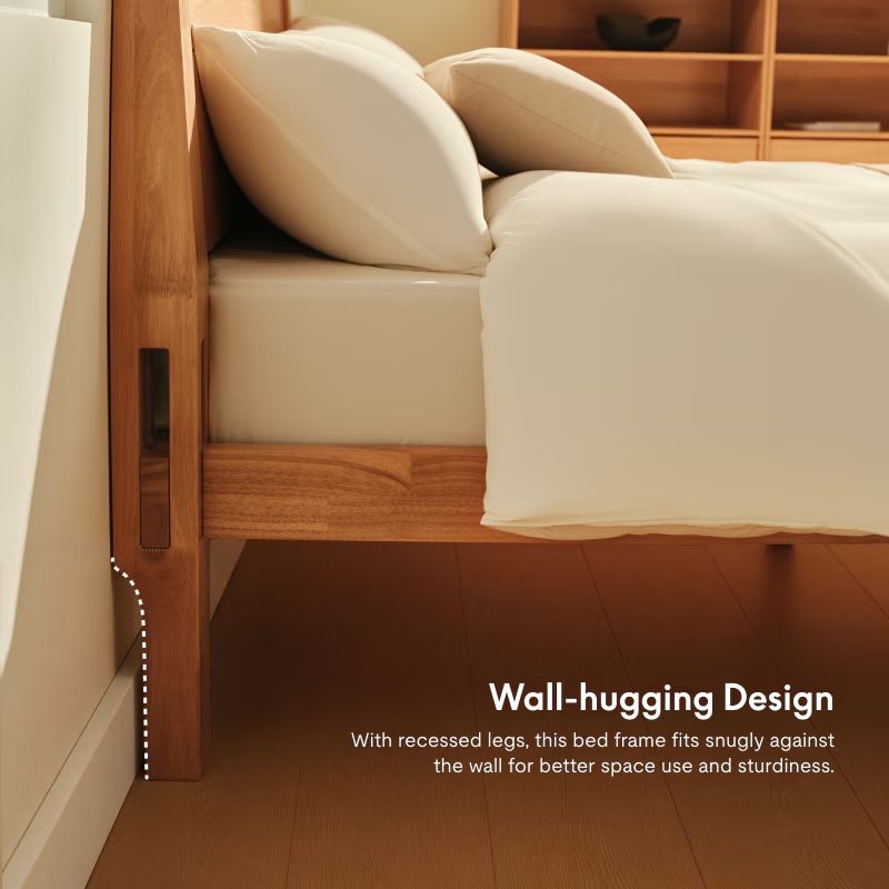 A bed with white sheets and pillows