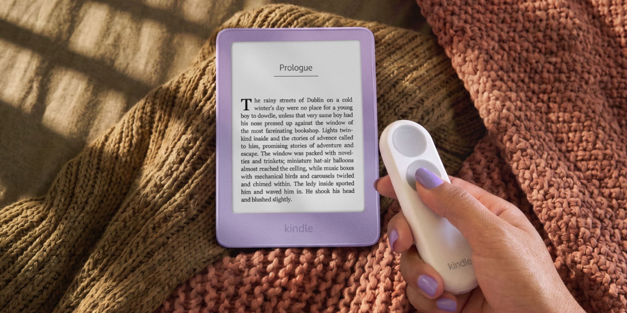 A hand holding a device with a book on it