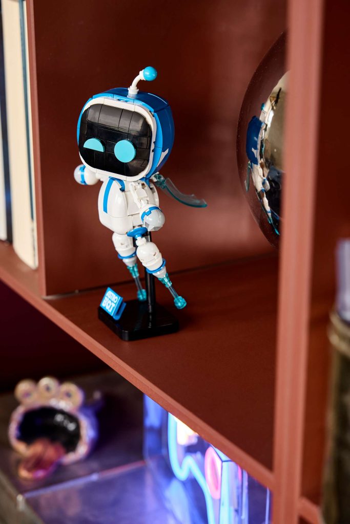 A toy robot on a shelf