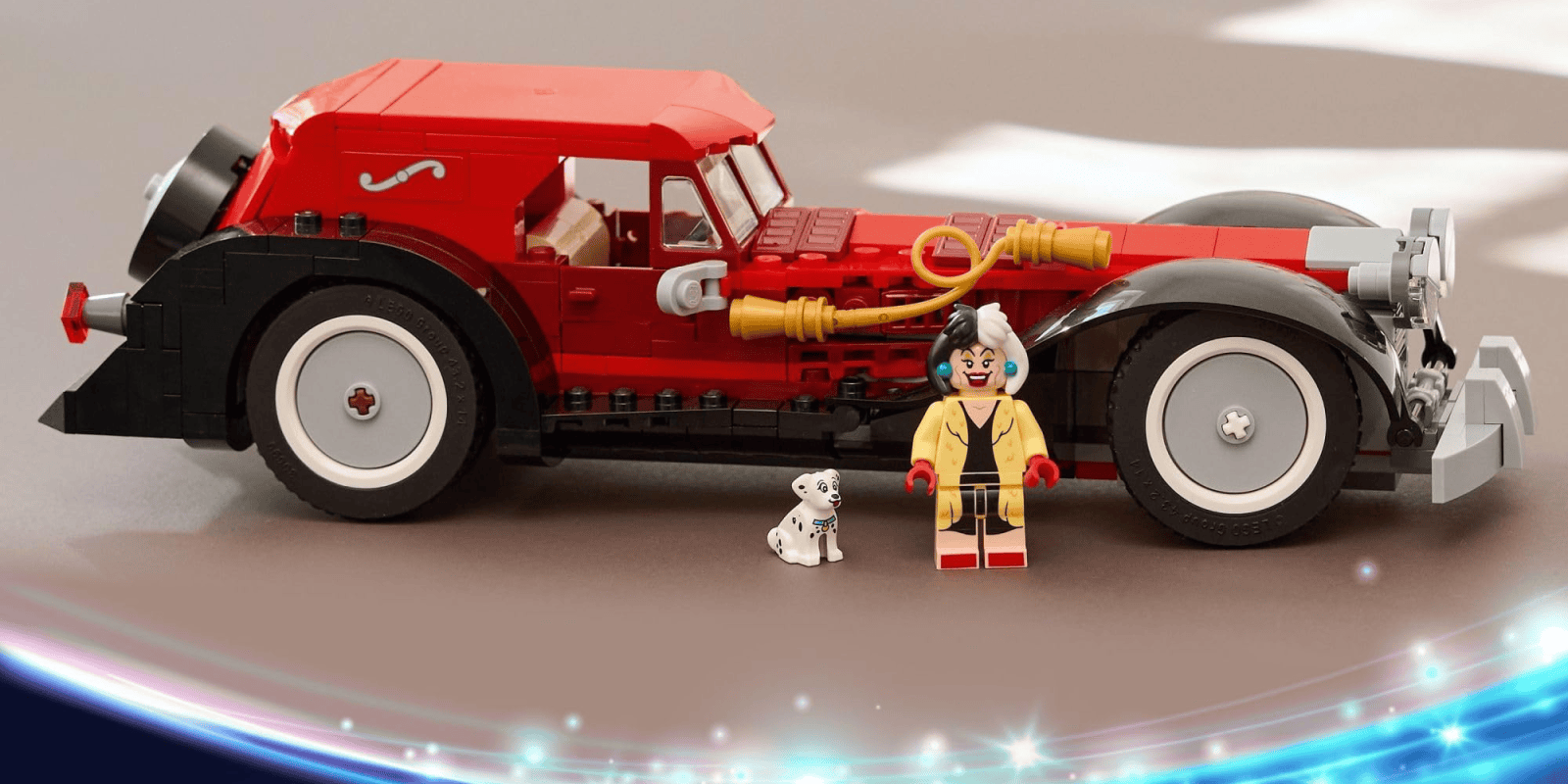 A toy car with a dog and a toy figurine