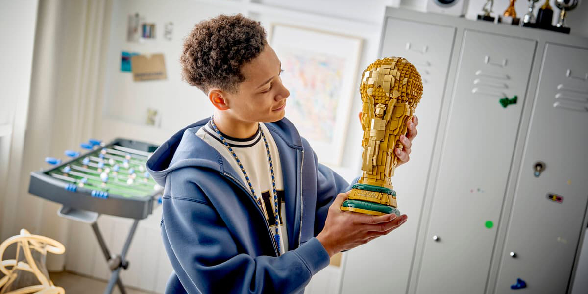 A boy holding a trophy