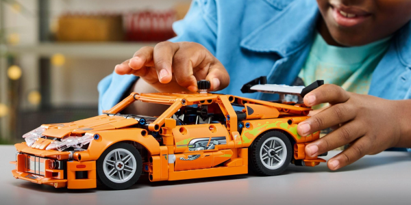 A child playing with a toy car
