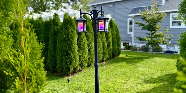 A lamp post in front of a house
