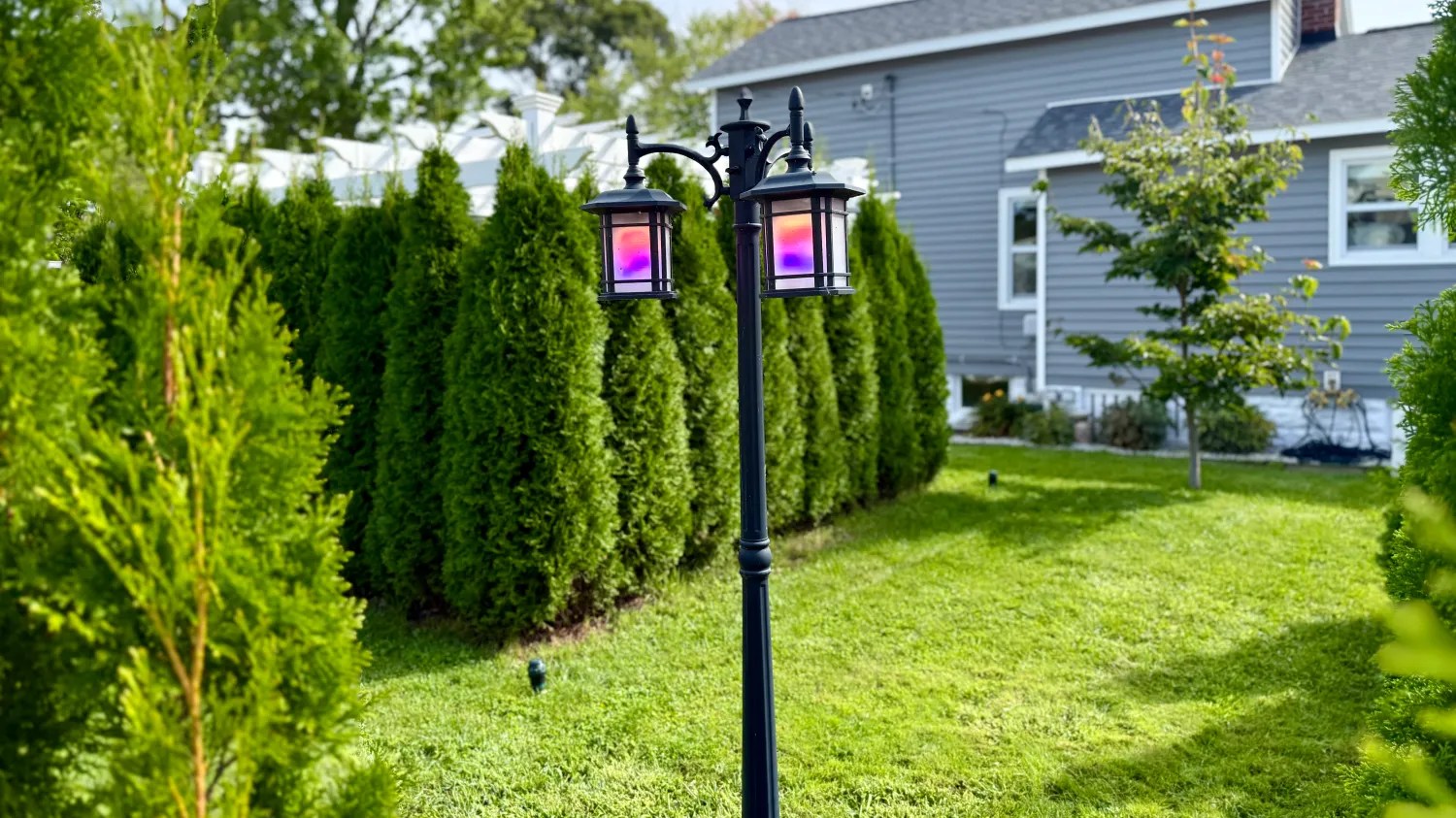 A lamp post in front of a house