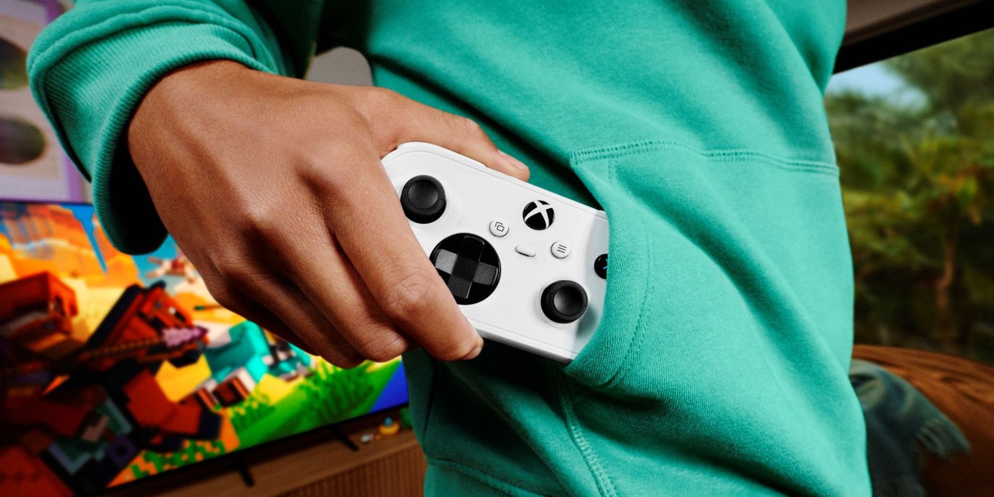 A person holding a video game controller in their pocket