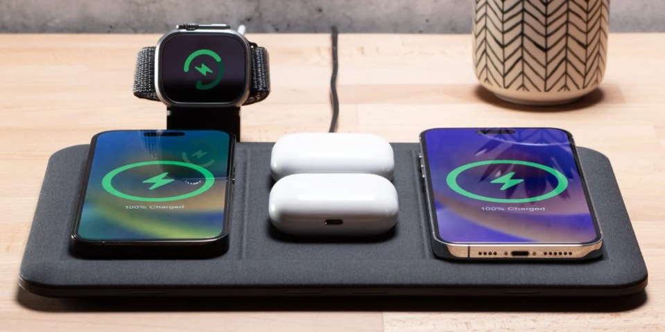 A group of smart phones and a pair of white wireless devices