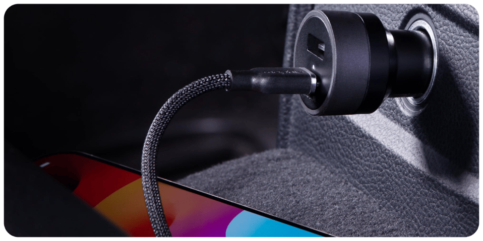 A black cord plugged into a charging device