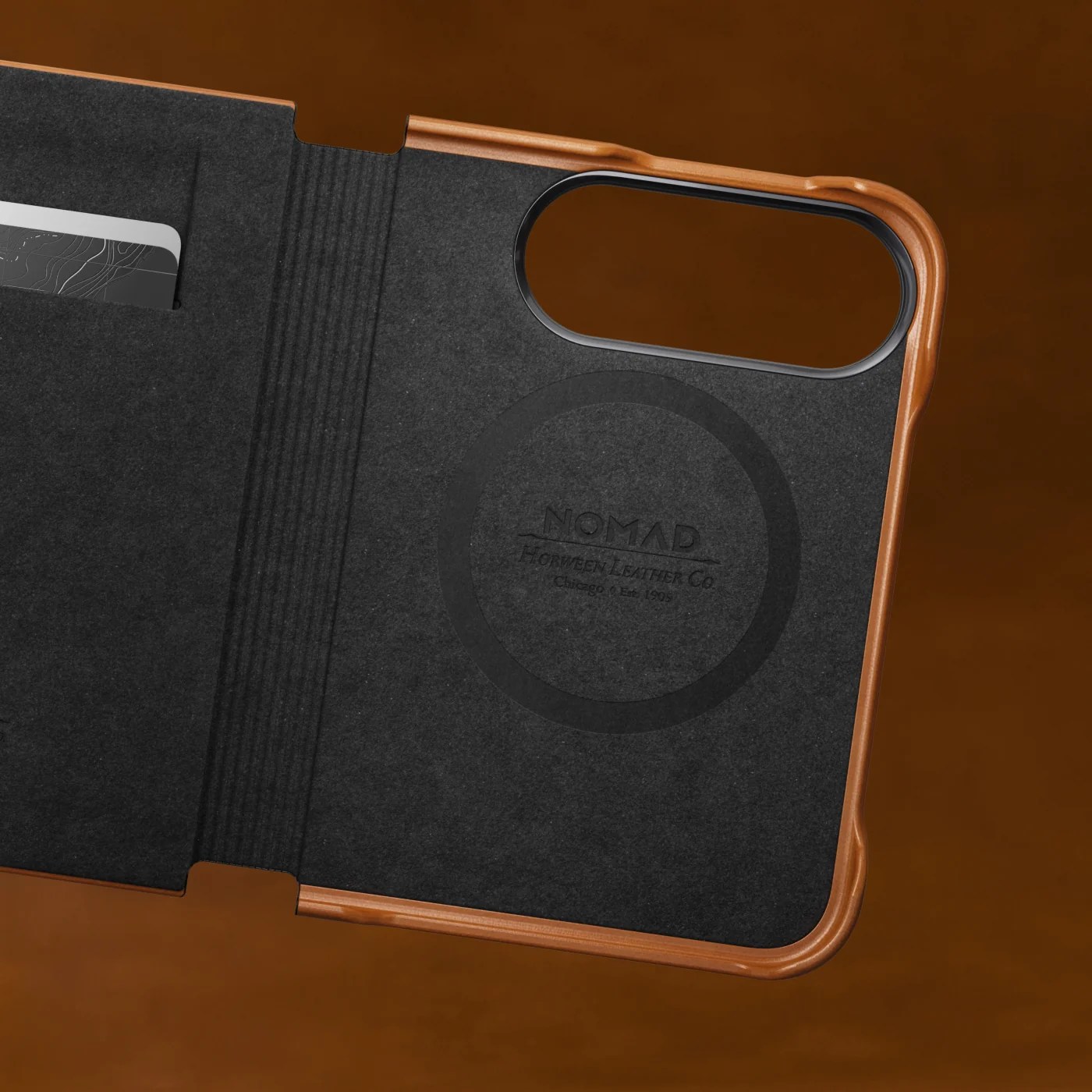 A black and brown case with a card in it
