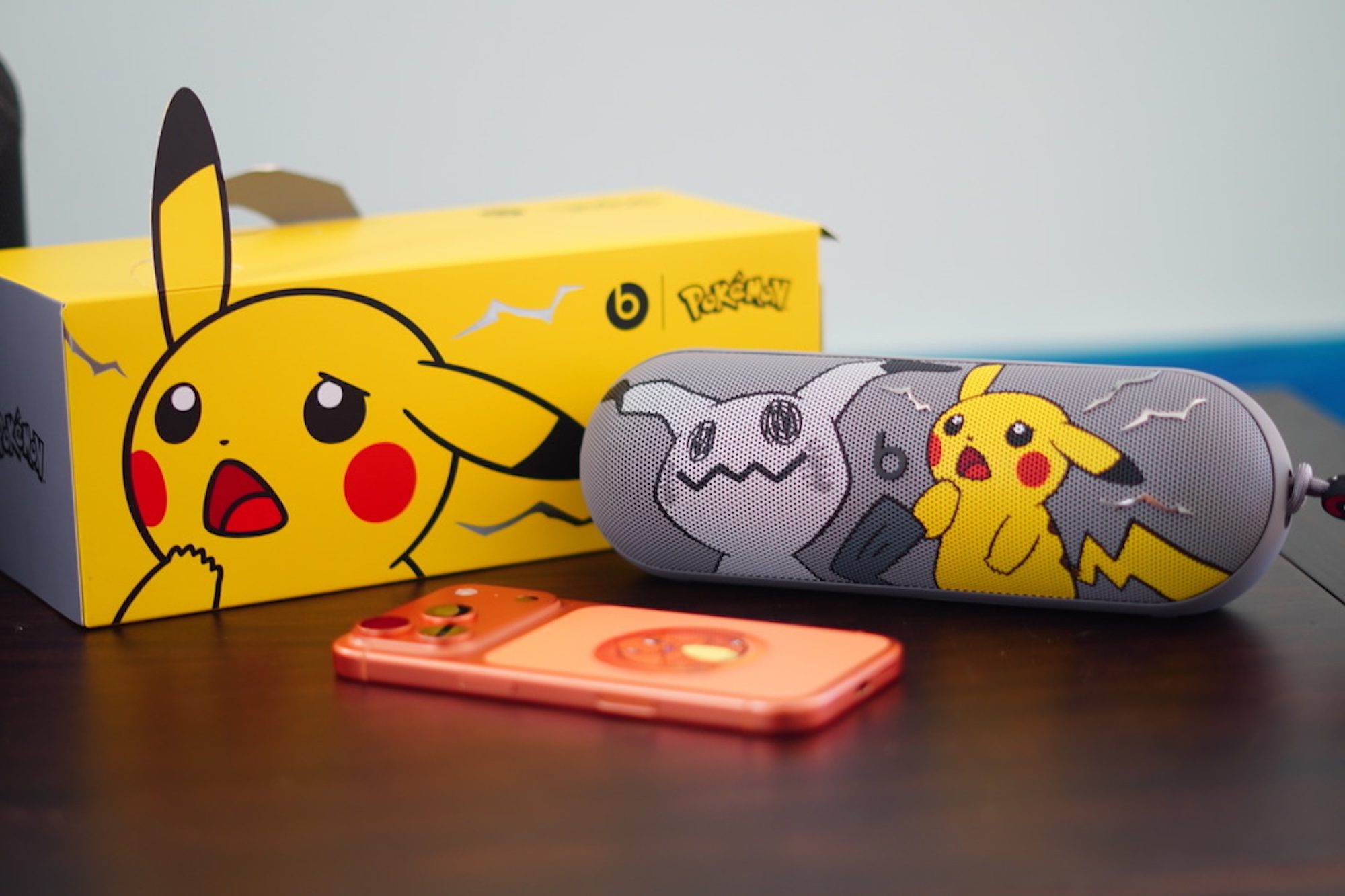 A box and a speaker on a table