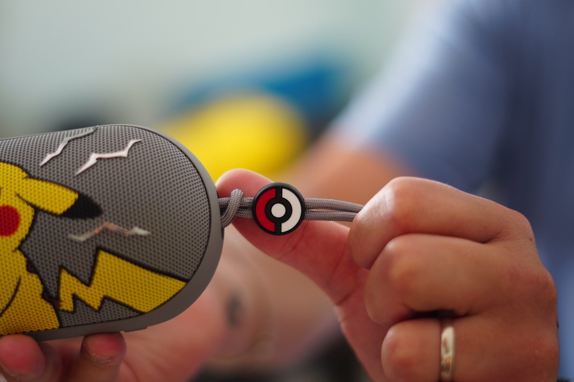 A person holding a small round object