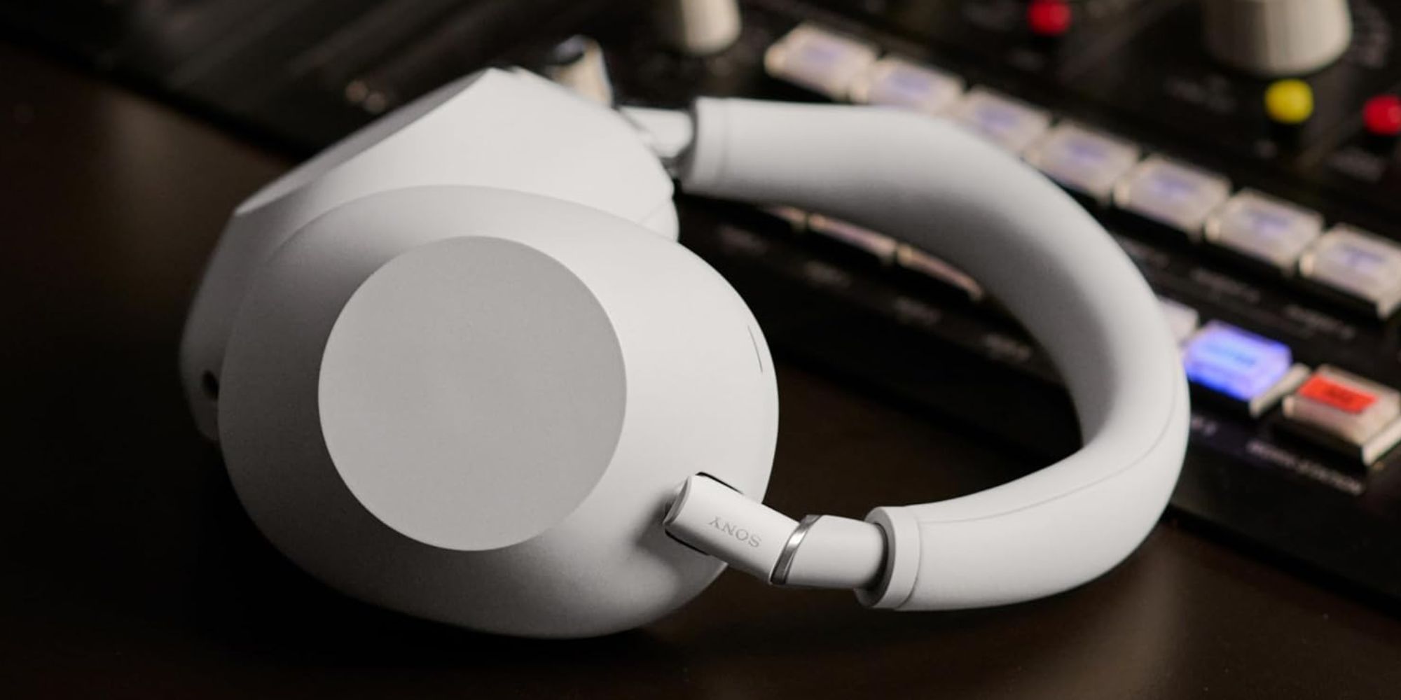 A white headphones on a black surface
