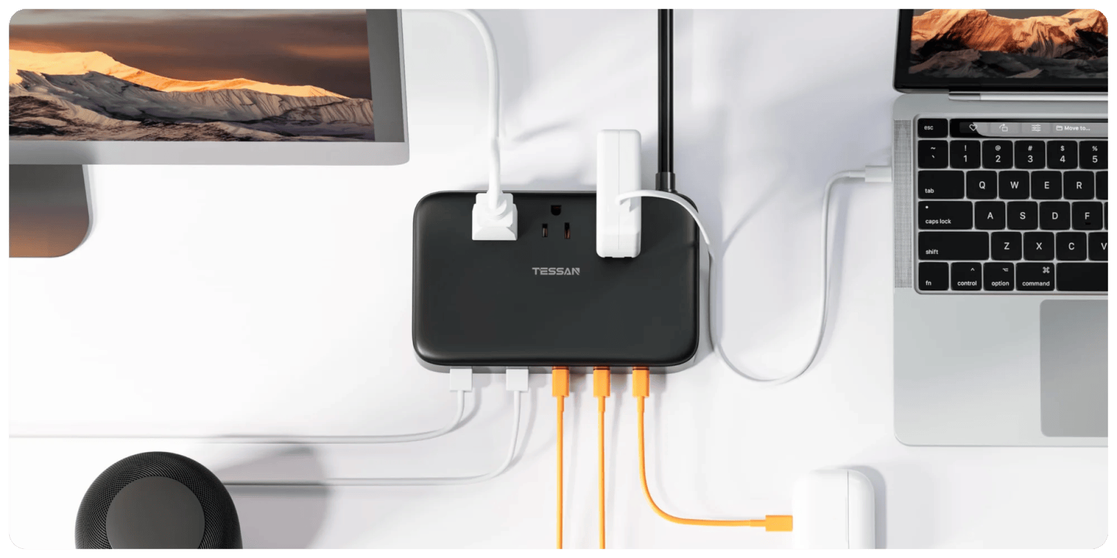 A black rectangular device with white cords connected to it