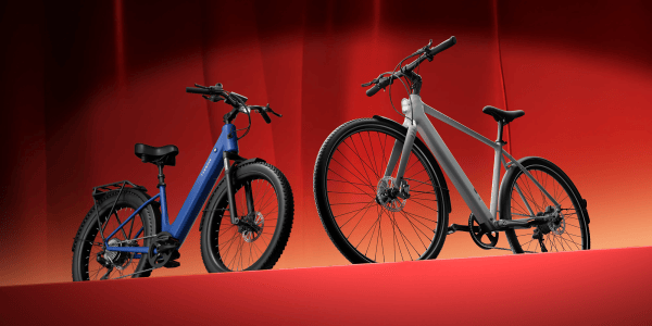 A blue and white bicycle next to a red background