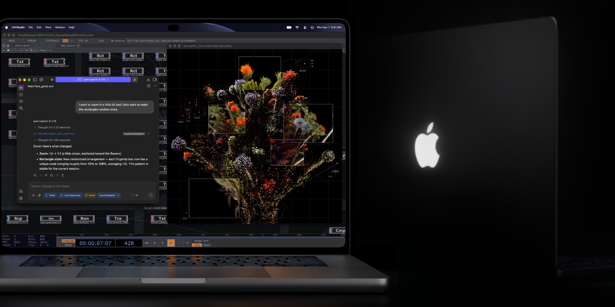 A laptop with a flower arrangement on the screen