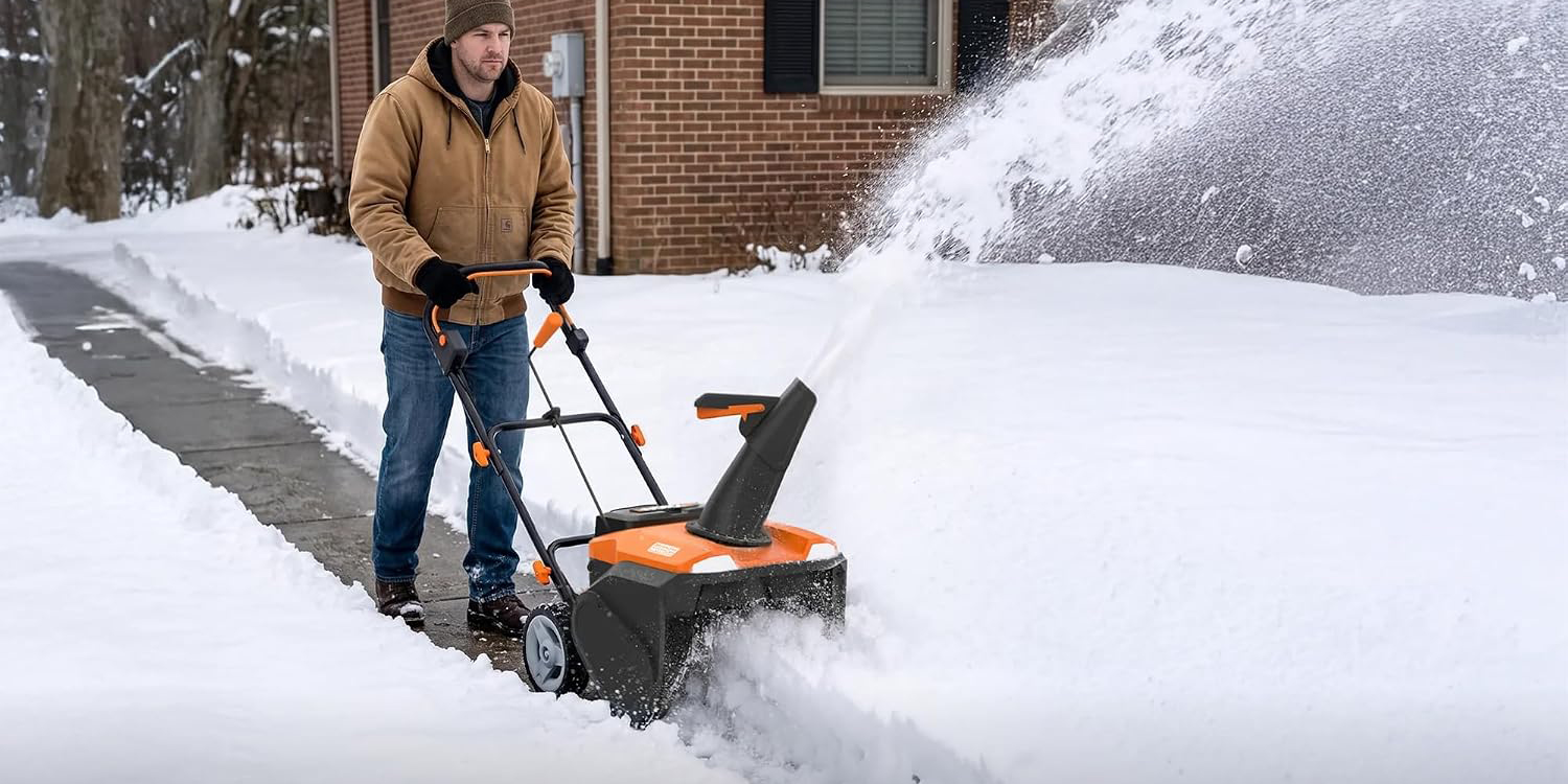 A man using a snow blower