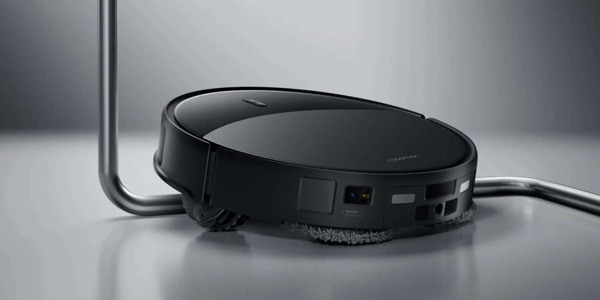 A black robot vacuum cleaner